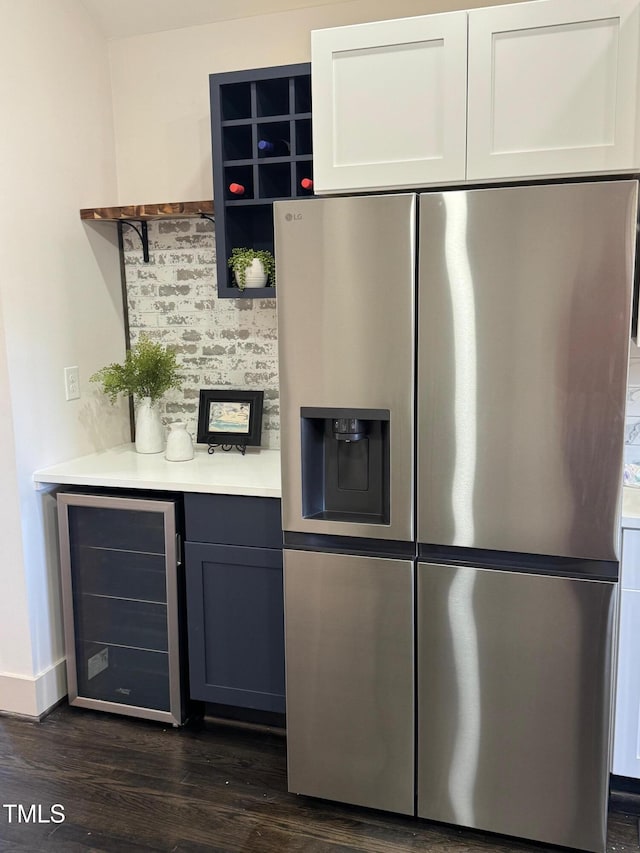 kitchen featuring white cabinetry, dark hardwood / wood-style floors, wine cooler, and stainless steel refrigerator with ice dispenser