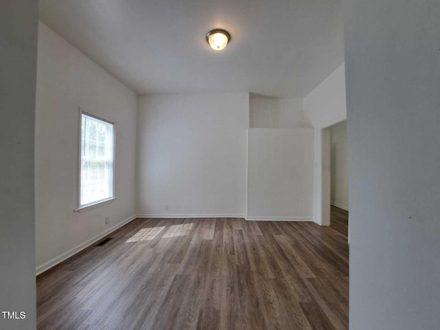 spare room with wood-type flooring