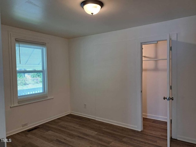 unfurnished room featuring dark hardwood / wood-style floors