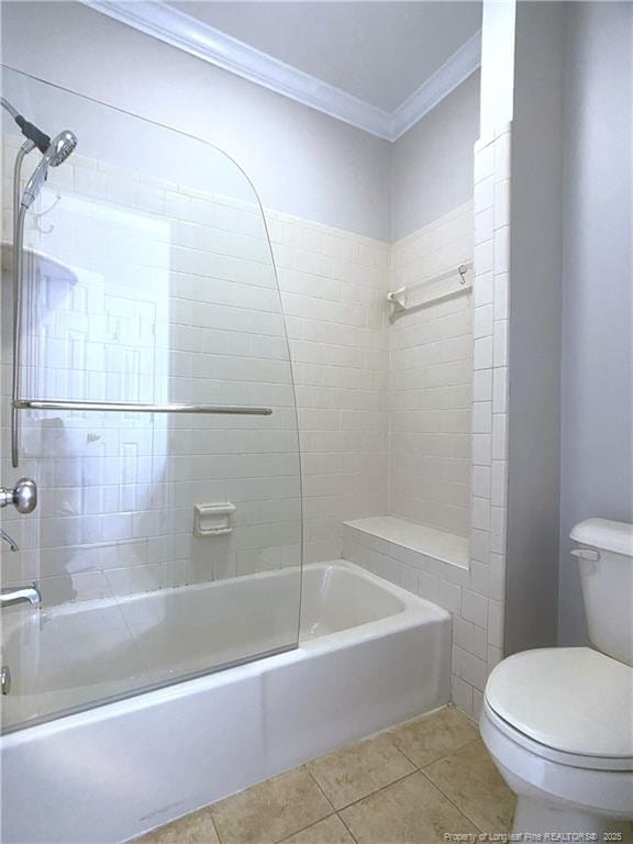 bathroom featuring toilet, tiled shower / bath, tile patterned flooring, and ornamental molding