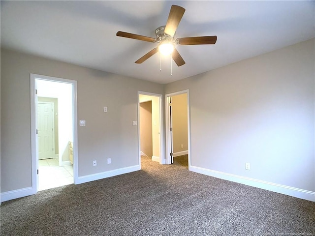 empty room with ceiling fan and carpet