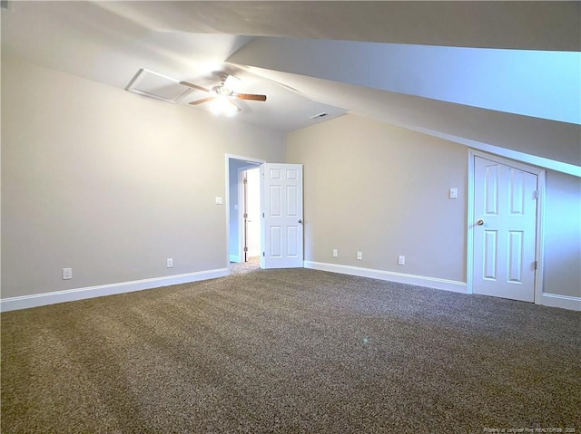 carpeted empty room featuring ceiling fan and vaulted ceiling