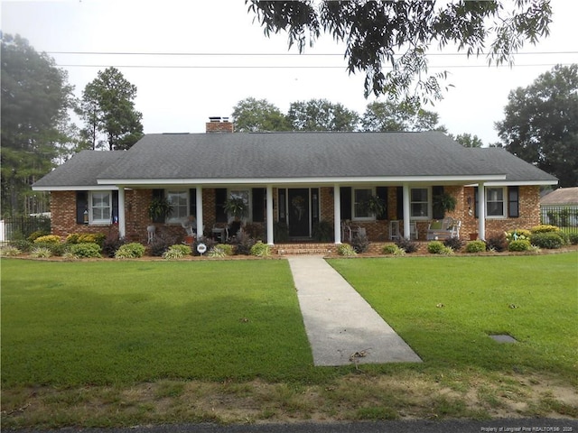 ranch-style home with a front lawn and a porch