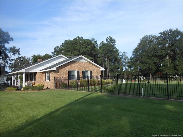 view of home's exterior with a lawn