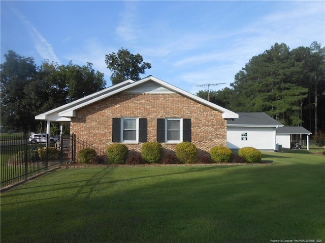 view of home's exterior with a lawn