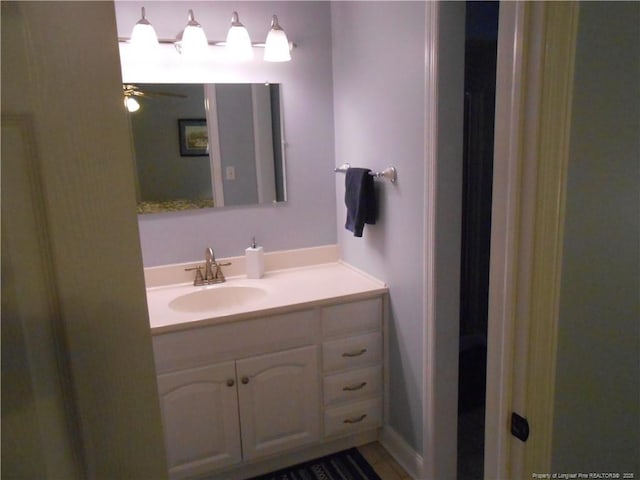 bathroom featuring vanity and ceiling fan