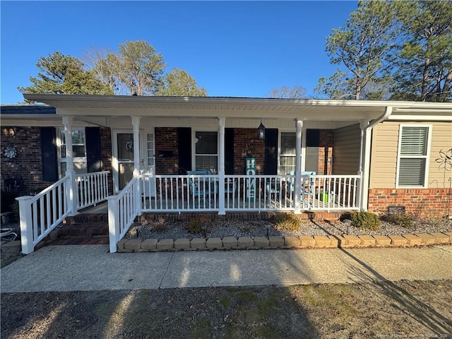 single story home featuring a porch