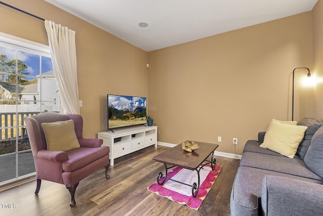 living room with dark hardwood / wood-style flooring