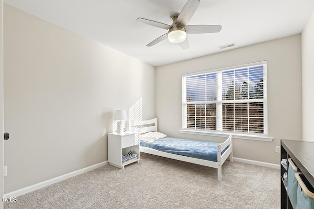 carpeted bedroom with ceiling fan