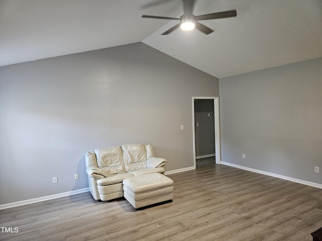 unfurnished room with ceiling fan, vaulted ceiling, and light hardwood / wood-style floors