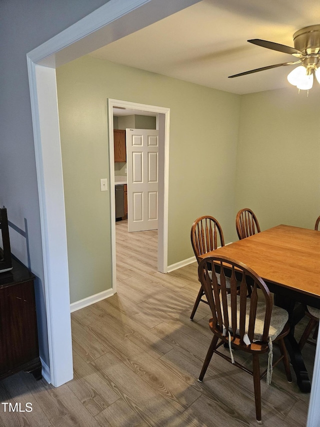 dining space featuring light hardwood / wood-style floors and ceiling fan