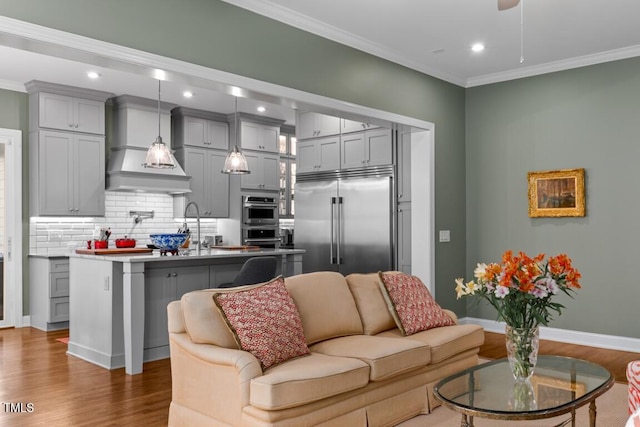 living room featuring ornamental molding, dark hardwood / wood-style floors, and ceiling fan