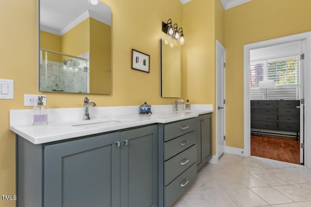 bathroom featuring vanity, a shower with shower door, and ornamental molding