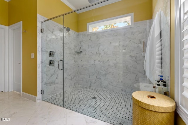 bathroom with an enclosed shower and ornamental molding