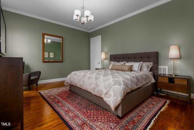 bedroom with an inviting chandelier, ornamental molding, and wood-type flooring