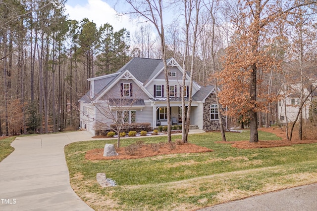 view of front of home with a front lawn and a porch