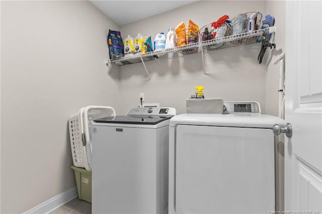 washroom featuring light tile patterned flooring and separate washer and dryer