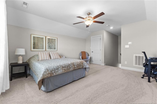 carpeted bedroom with vaulted ceiling and ceiling fan