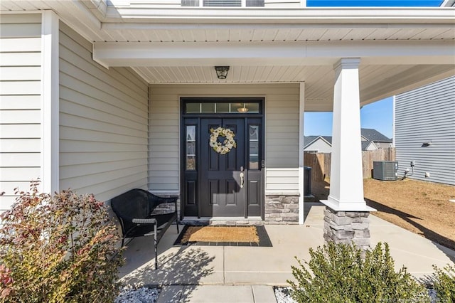 doorway to property featuring central air condition unit