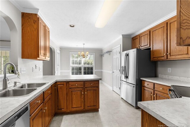 kitchen with kitchen peninsula, sink, hanging light fixtures, stainless steel appliances, and a chandelier