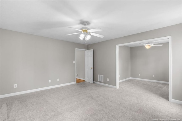 carpeted empty room with ceiling fan