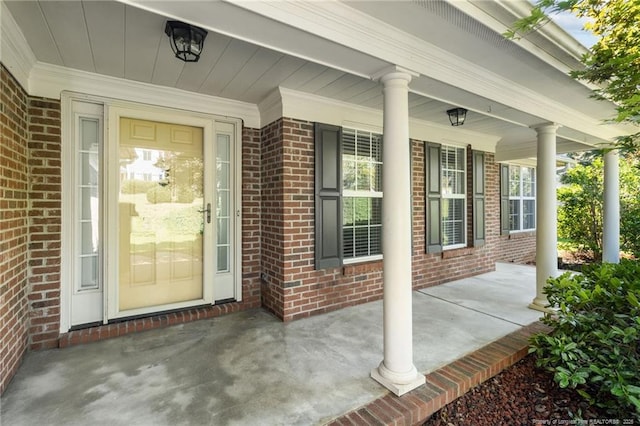 view of exterior entry featuring a porch