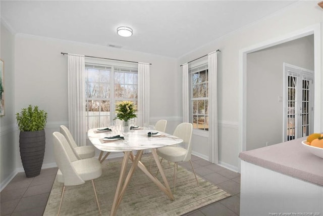 dining space with tile patterned floors and french doors