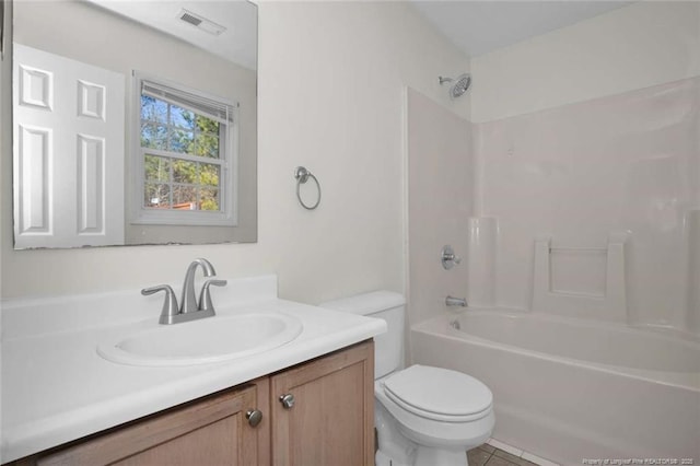 full bathroom with toilet, vanity, tile patterned floors, and shower / washtub combination