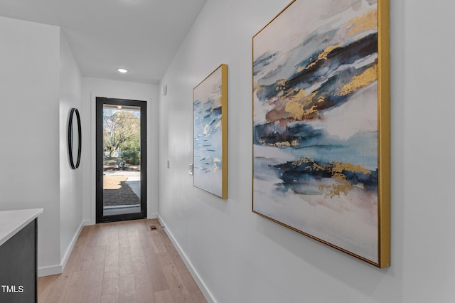 doorway to outside with light hardwood / wood-style flooring