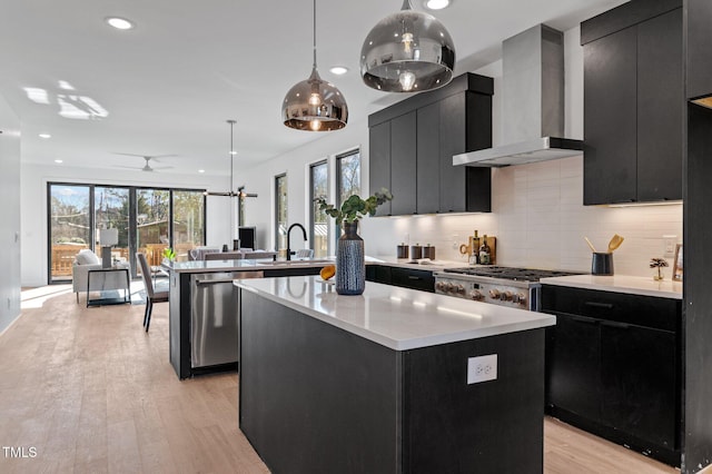 808 Culpepper Ln, Raleigh, NC 27610 - kitchen with decorative light fixtures, dishwasher, backsplash, a center island, and wall chimney range hood