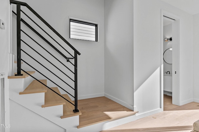 808 Culpepper Ln, Raleigh, NC 27610 - stairway featuring wood-type flooring