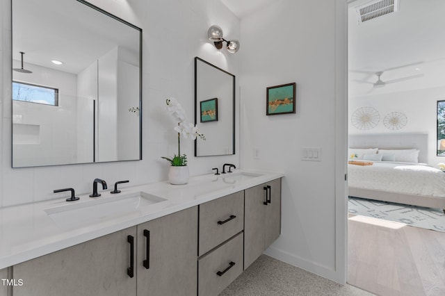 808 Culpepper Ln, Raleigh, NC 27610 - bathroom featuring vanity, ceiling fan, and walk in shower