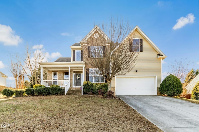 front facade with a garage, a front yard, and a porch