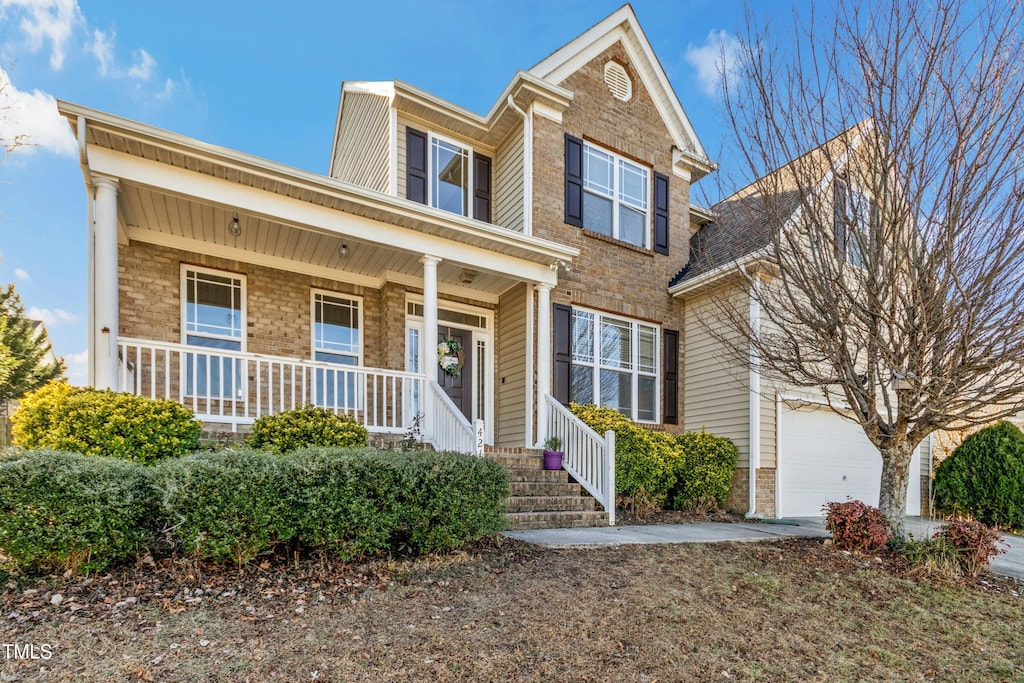 view of front of house with a garage and covered porch