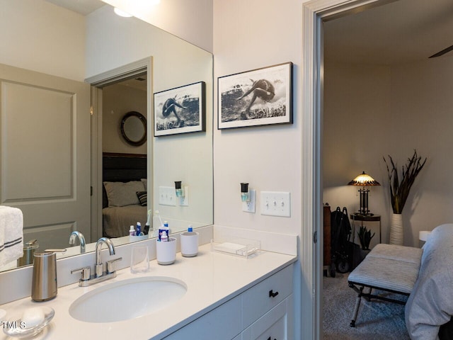 bathroom with ensuite bathroom and vanity