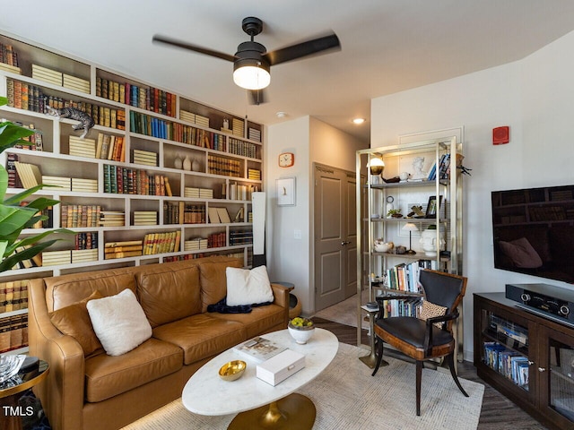 living room with ceiling fan and recessed lighting