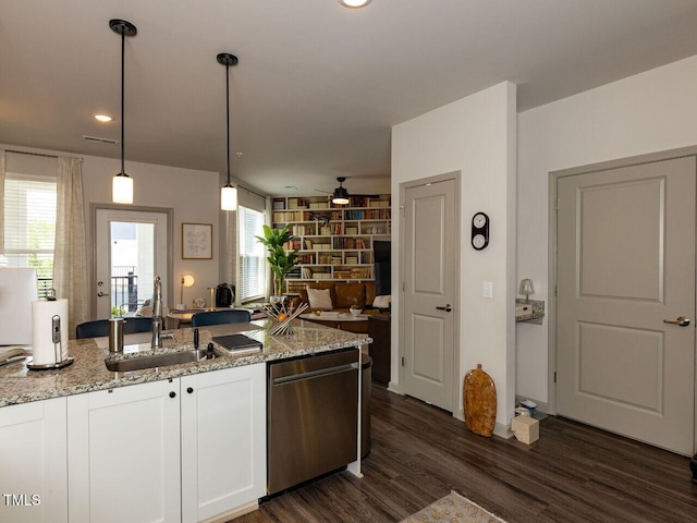 kitchen featuring dishwasher, a sink, white cabinetry, ceiling fan, and light stone counters