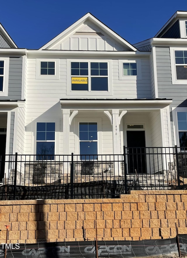 view of front facade featuring board and batten siding and metal roof