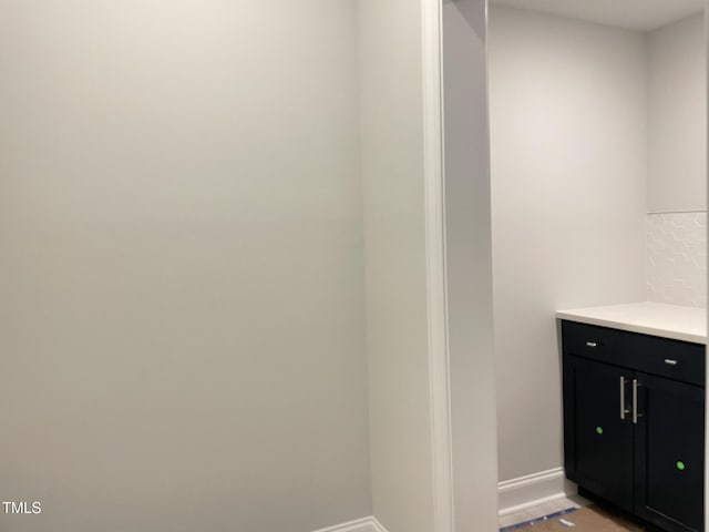 bathroom with vanity and baseboards