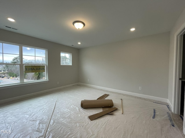 interior space with visible vents, recessed lighting, and baseboards