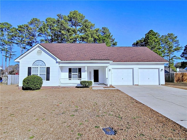 ranch-style home featuring a garage and covered porch