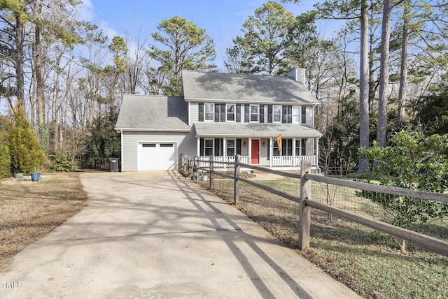 colonial house with a garage and a porch