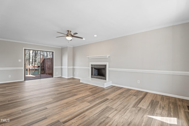 unfurnished living room with crown molding, hardwood / wood-style floors, and ceiling fan