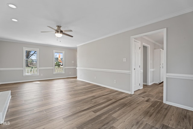 spare room featuring crown molding, hardwood / wood-style floors, and ceiling fan