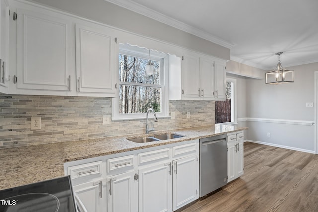 kitchen with sink, crown molding, decorative light fixtures, stainless steel dishwasher, and white cabinets