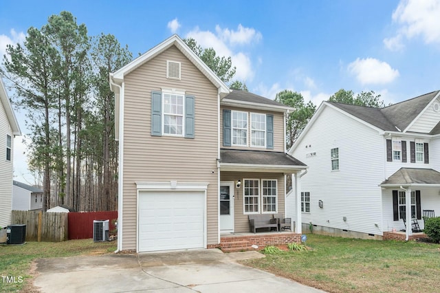 view of property featuring a front yard, a garage, and cooling unit