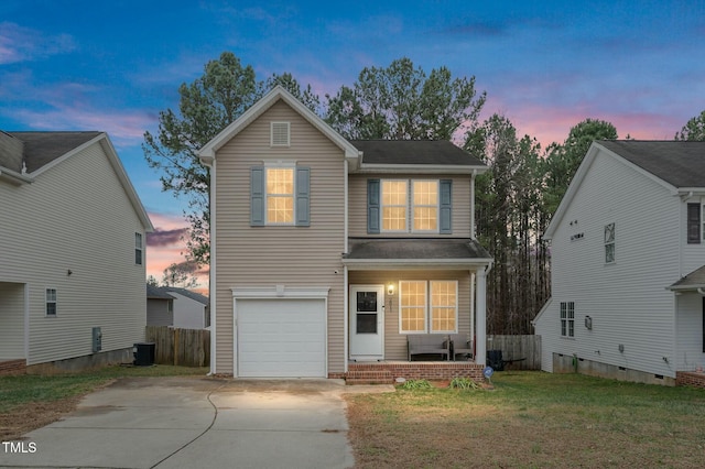 view of front property with a garage, a lawn, and central air condition unit