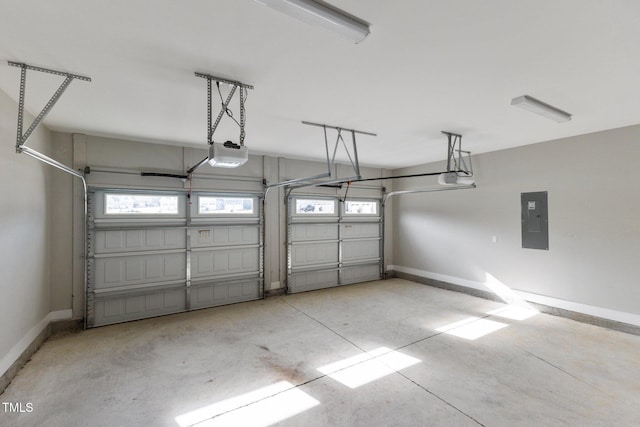 garage featuring electric panel and a garage door opener