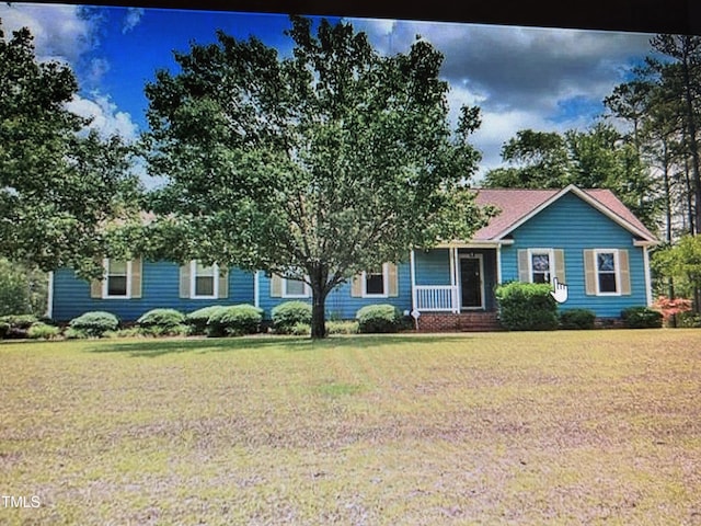 view of front of property with a front lawn