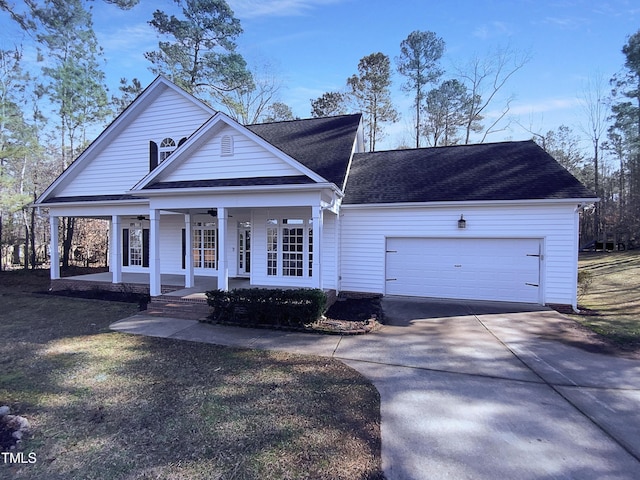 view of front of house featuring a garage and a porch